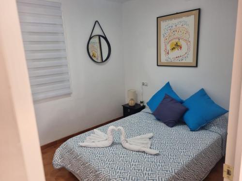 a bedroom with a bed with two towels on it at Appartement Cambrils in Cambrils