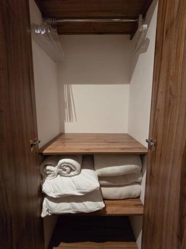 a closet with a bunch of folded towels at Dk8 - Nice studio in Zona Viva in Guatemala