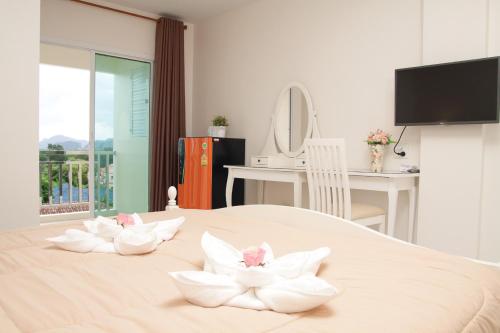 Ένα ή περισσότερα κρεβάτια σε δωμάτιο στο JS Residence Krabi