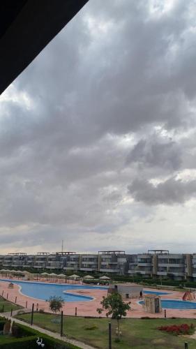 a large pool of water in front of a building at Chalet in Blumar Ain soknha in Ain Sokhna