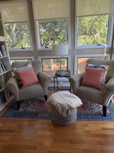a living room with two chairs and a table at 3017 Ocean Winds in Seabrook Island