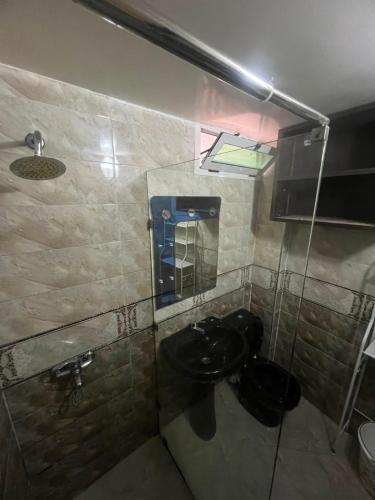 a bathroom with a sink and a mirror at la perle d'el jadida in El Jadida