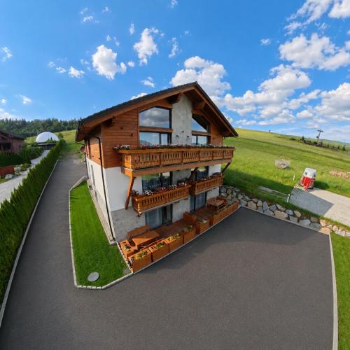 a rendering of a house with a balcony at Apartmány Dominek in Ždiar