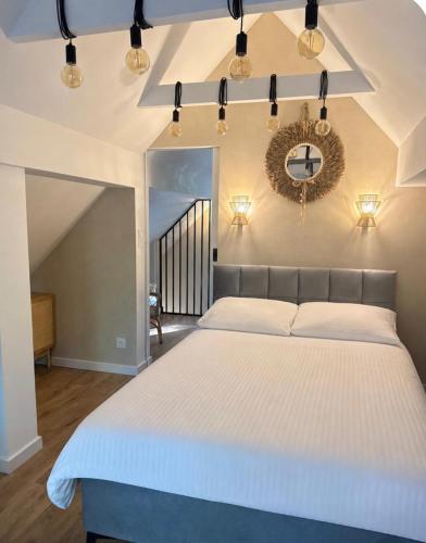 a bedroom with a large bed and a mirror at Magiczne Roztocze in Koszele