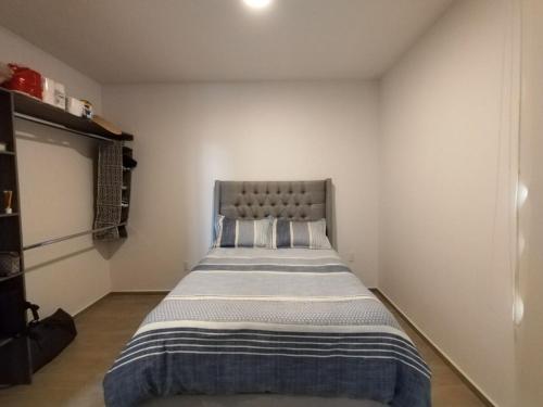 a bedroom with a large bed in a room at Relax at the lake - Pool - Pet friendly - WiFi in Chantepec