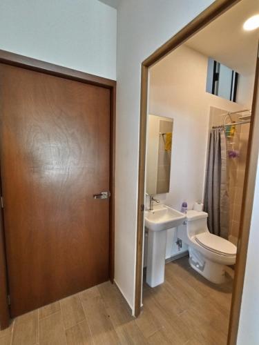 a bathroom with a toilet and a sink at Relax at the lake - Pool - Pet friendly - WiFi in Chantepec