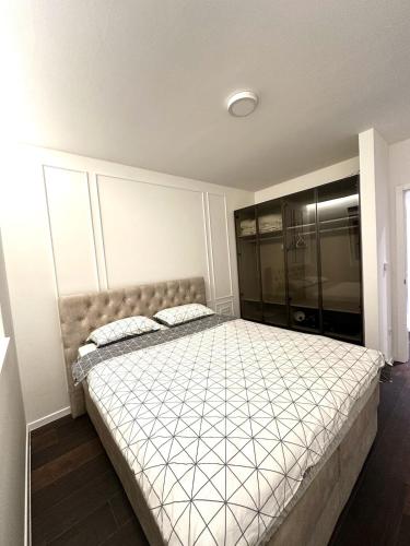 a bedroom with a large bed in a room at Apartment Niko in Posušje