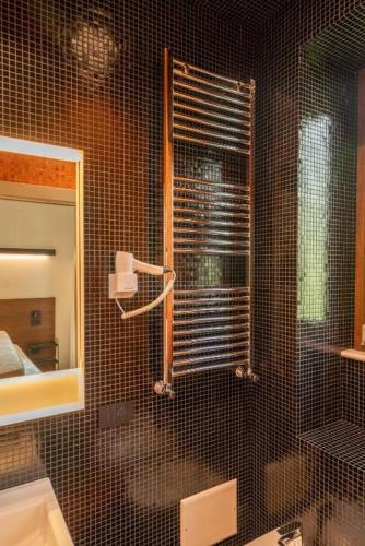 a bathroom with a shower with a glass door at Ca'santoro 3 in Agerola