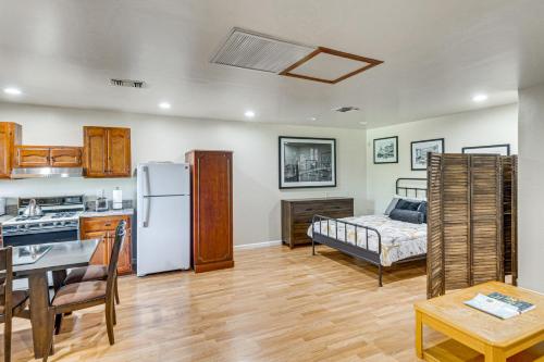 a kitchen and living room with a refrigerator and a bed at Quiet Patio! La Cañada Month-Long Studio in La Canada Flintridge