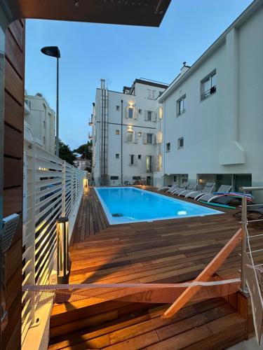 a swimming pool on the deck of a building at hotel Torretta Bramante in Rimini