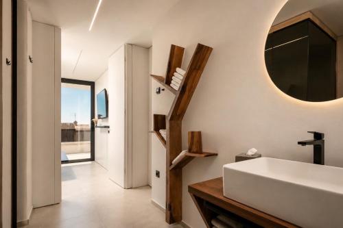 a bathroom with a sink and a mirror at Villa9eleven in Novigrad Istria