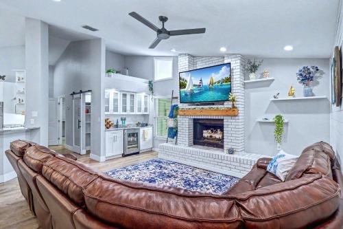 a living room with a couch and a fireplace at Paradise On Park in Seminole
