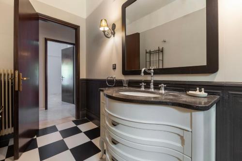 a bathroom with a sink and a mirror at Thimeli Hotel in Lygourio
