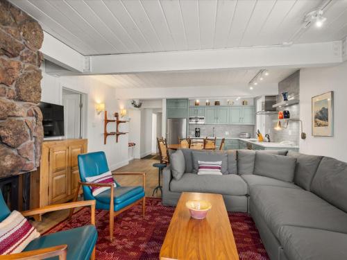 a living room with a couch and a table at Lift One Condominiums - Unit 305 in Aspen