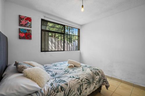 a bedroom with a bed and a window at Your Home in León Top Location in León