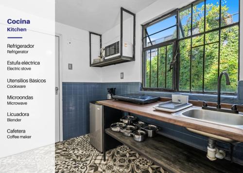 a kitchen with a sink and a counter with a window at Your Home in León Top Location in León