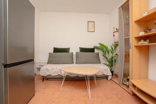 a small room with a table and a couch at House Punta in Kraj