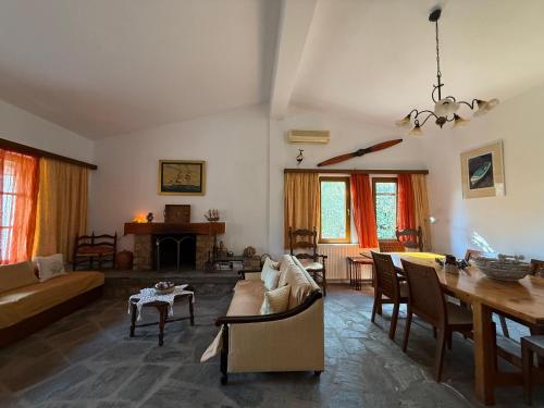 a living room with a couch and a table at Casa Kaikos in Sevastí