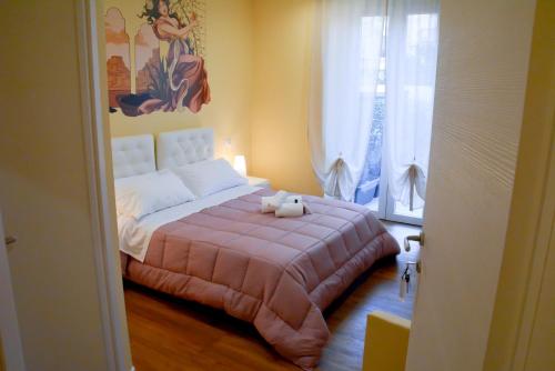 a bedroom with a bed with a stuffed animal on it at Le Veneri Del Golfo in La Spezia