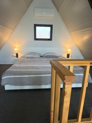 a bedroom with a bed in a attic at Valdiz in Zahlé