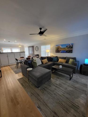 a living room with a couch and a table at Terrace On Main Street in Murphys