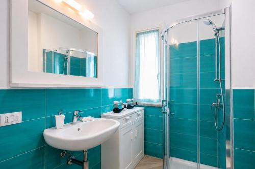 a bathroom with a sink and a shower at Casa Andreale in Capoliveri