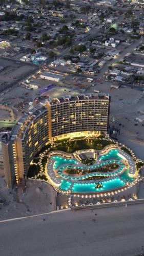 an aerial view of a large building with lights at Sonoran Star Luxury 3 Bedroom Breachfront Condominium in Puerto Peñasco