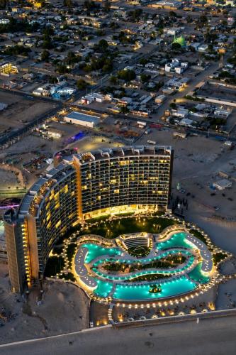 an aerial view of a resort building at night at Sonoran Star Beach Front Apartment Getaway in Puerto Peñasco