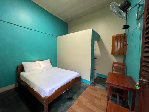 A bed or beds in a room at The Grindio Hostel