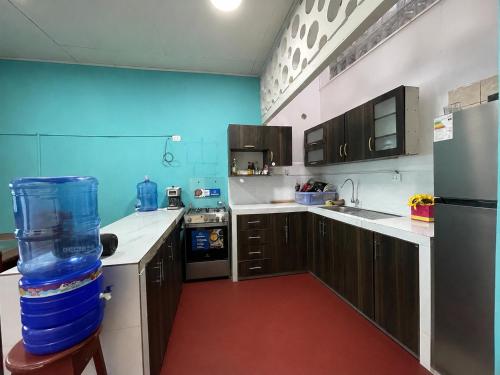 A kitchen or kitchenette at The Grindio Hostel