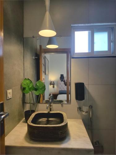 a bathroom with a sink with a tire on it at The Crib, Murree Hills in Lower Topa