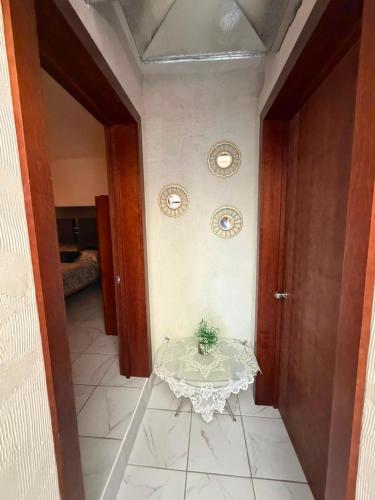 a table in a hallway with a table in a room at Casa Rivota in Delicias