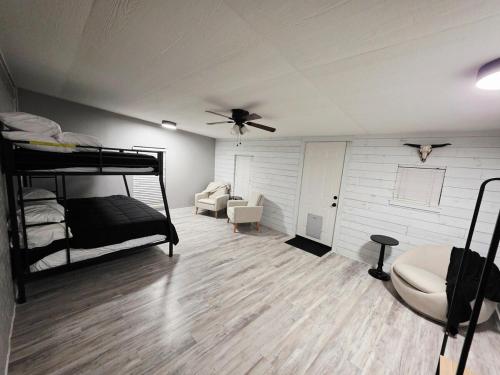 a bedroom with bunk beds and a ceiling fan at North Shore Lake Community in The Colony
