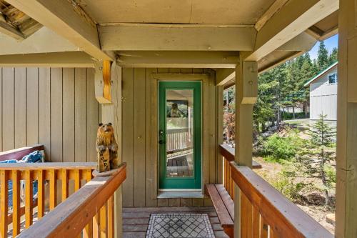 a dog sitting on the porch of a house at Stargazing Retreat in Tamarack in Big Creek