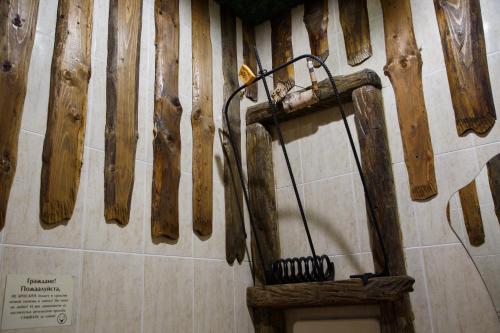 
a wooden cutting board on a wooden floor at Koshkin Dom in Myshkin
