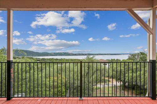 a view of the water from the balcony of a house at Mountain Trail Retreat in Austin