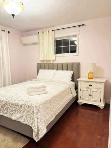 a bedroom with a bed and a window at Private MasterBedroom in Charlottetown
