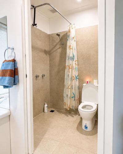 a bathroom with a toilet and a shower at Private Guest Studio House, Separate Entry in Brisbane