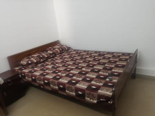 a bed in a room with at Railviewtouristhome in Varkala