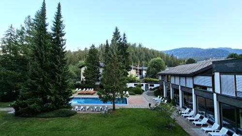 an aerial view of a house with a pool at Rancho Laaxdeluxe in Laax
