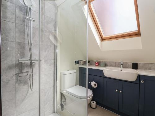 a bathroom with a shower and a toilet and a sink at Redwoods in Beverley