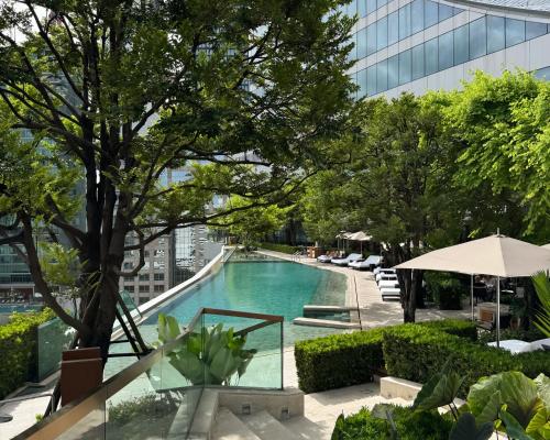 a swimming pool on the roof of a building at Park Hyatt Bangkok in Bangkok