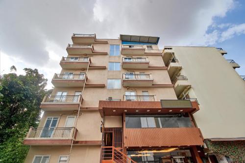 a tall building with balconies on the side of it at Itsy Hotels Emirates Suites - Near RMZ EcoWorld, Bellandur in Bangalore