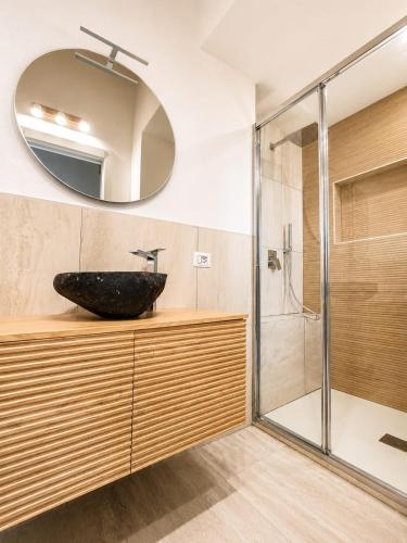 a bathroom with a sink and a shower at Marconi 306 in Quartu Sant'Elena