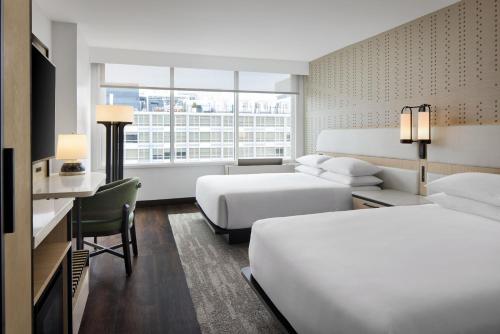 a hotel room with two beds and a desk at Hyatt Regency Washington on Capitol Hill in Washington, D.C.