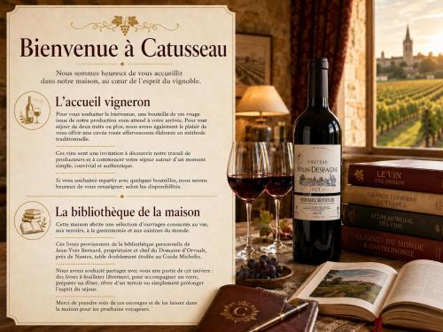 a bottle of wine sitting next to a glass of wine at Grande maison en pierre à Pomerol - 3 chambres, parking, proche Saint-Emilion in Pomerol