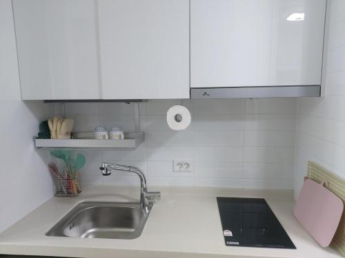 a kitchen with a sink and a counter top at Guri 365 Stay in Guri