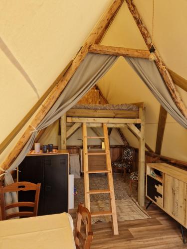 a room with a loft bed in a tent at Tente Lodge Logement Insolite 4pers Campagne Normande Orne in Ménil-Hubert-sur-Orne