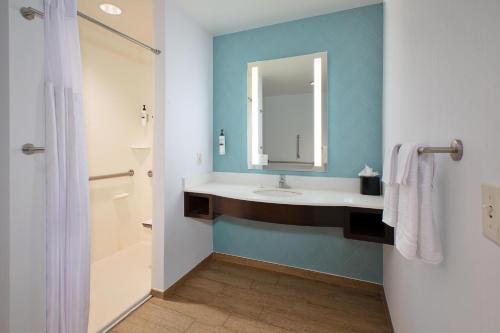 a bathroom with a sink and a mirror at Hilton Garden Inn Akron in Akron