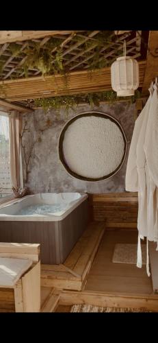 a bathroom with a bath tub and a tub at Villa Sainte Anne in Sénas